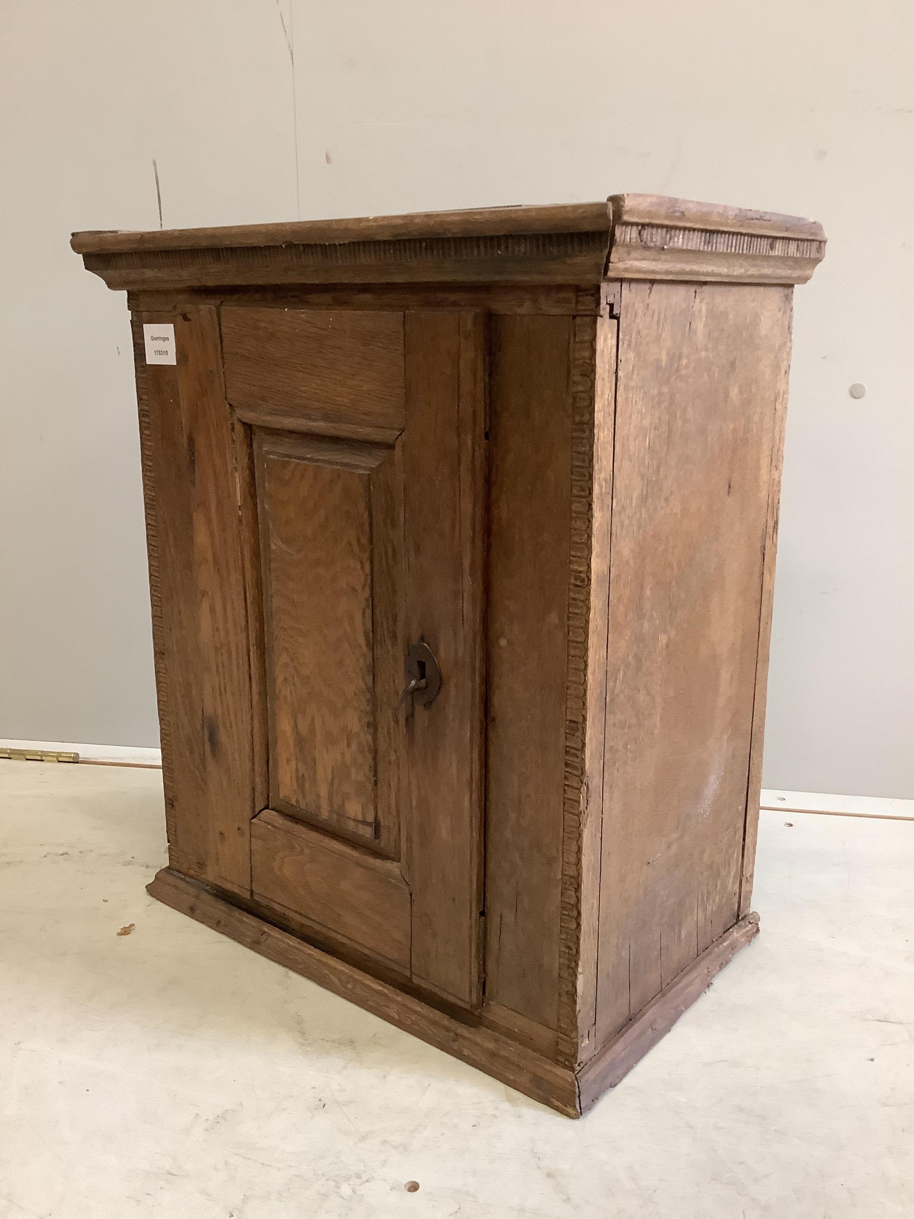 A small oak cupboard, width 51cm, depth 31cm, height 59cm